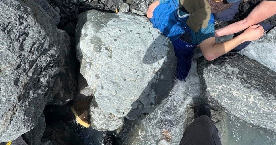 Alaska man unscathed after being pinned for hours by 700-pound boulder