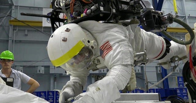 Astronauts conduct challenging spacewalk to fix experiment