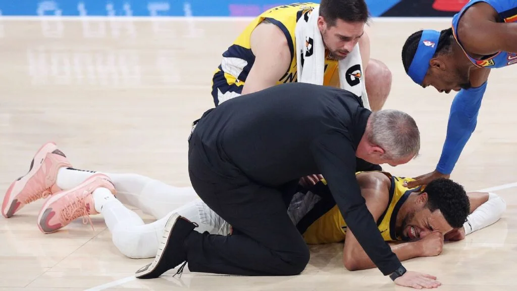 Emotional Haliburton helped off with leg injury